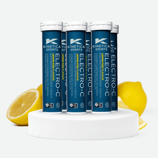 6 Kinetica Sports Electro-C tubes with lemon slices on a light green background